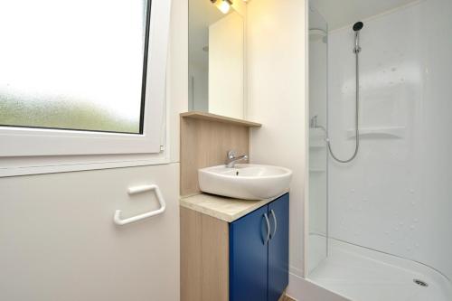 a bathroom with a sink and a shower at Holiday house in Drage with sea view, balcony, air conditioning,W-LAN 571-1 in Drage