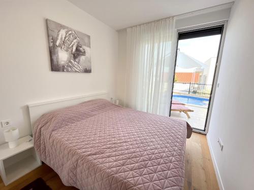 Katil atau katil-katil dalam bilik di Luxury Apartment Ansi