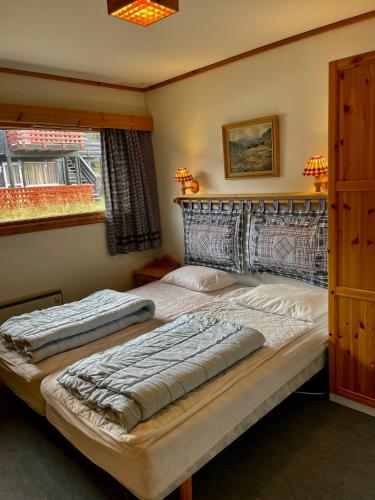 Ένα ή περισσότερα κρεβάτια σε δωμάτιο στο Cozy apartment with a view and ski inout Hafjell