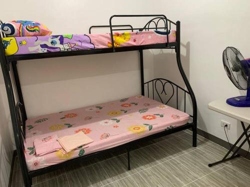 a couple of bunk beds in a room at Romblon Transient House in Romblon