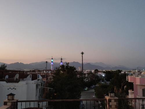 a view of a city with towers in the distance at Farsha View in Sharm El Sheikh
