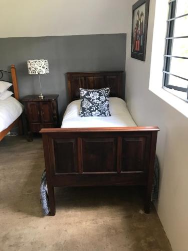 a bed with a pillow on it in a room at BAA BAA RESIDENCE in Hillcrest