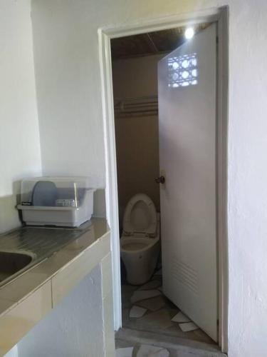 a small bathroom with a toilet and a sink at Overview in Loon
