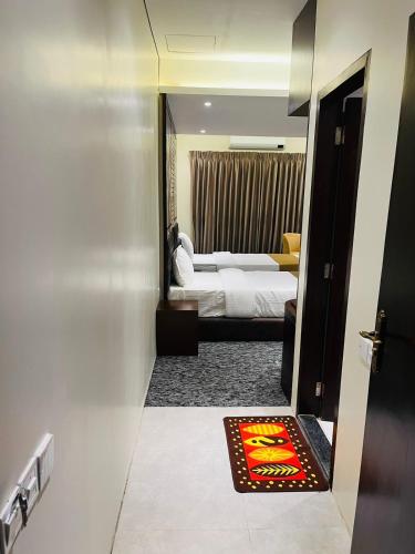 Richmond Hotel Sylhetにあるベッド