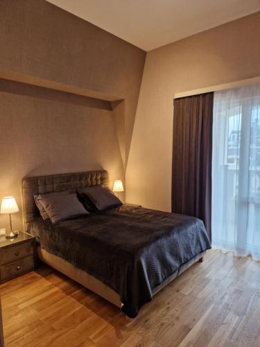 Postel nebo postele na pokoji v ubytování АПАРТАМЕНТ RESORT SENSATION 2