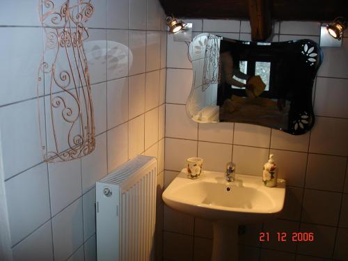 a person taking a picture of a sink in a bathroom at Fanis & Lena in Palaios Agios Athanasios