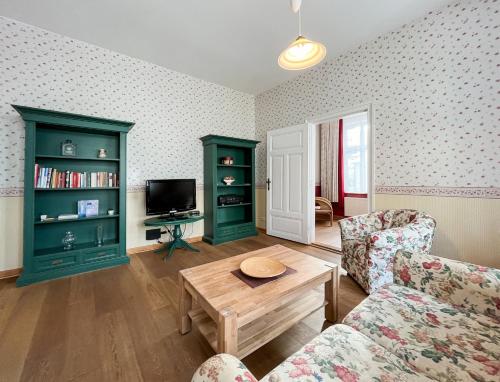a living room with a couch and a coffee table at Haus Borgwardt im Ostseebad Göhren in Göhren