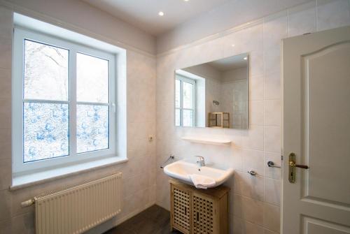 a bathroom with a sink and a window at Haus Borgwardt im Ostseebad Göhren in Göhren