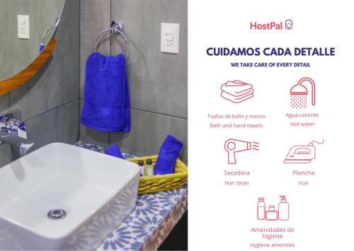 a bathroom with a white sink and a blue towel at Madre tierra suites tlalpujahua centro in Tlalpujahua de Rayón
