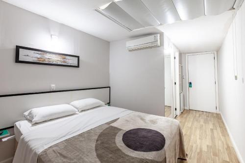 Tri Hotel Smart Caxiasにあるベッド