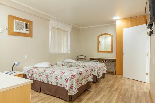 Tri Hotel Smart Caxiasにあるベッド