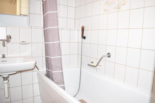 a bathroom with a shower and a sink at Ladina 65 (319 St) in Lenzerheide