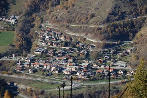 an aerial view of a small village on a mountain at Gîte Les Grands Champs in Bellentre