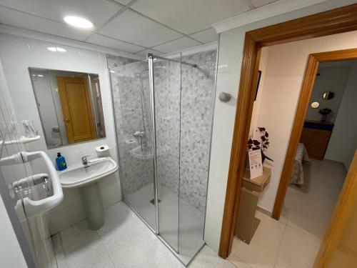 a bathroom with a shower and a sink at Villa Hortensia - Primera linea playa la concha in Oropesa del Mar