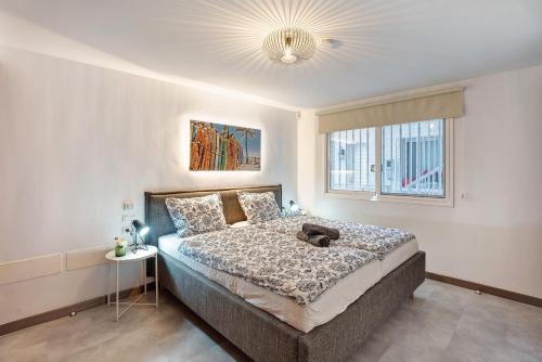 a bedroom with a large bed and a window at Casa Hola Mar in Los Realejos