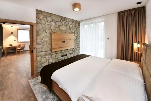 Postel nebo postele na pokoji v ubytování APLEND Hotel Ovruč