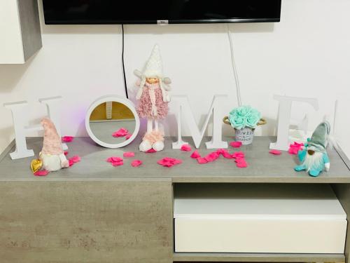 a shelf with a bunch of dolls sitting on it at B&B Marrelli Crotone in Crotone