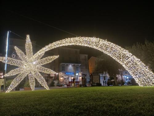 a star light sculpture in a park at night at Pensione Delfino Azzurro in Loreto