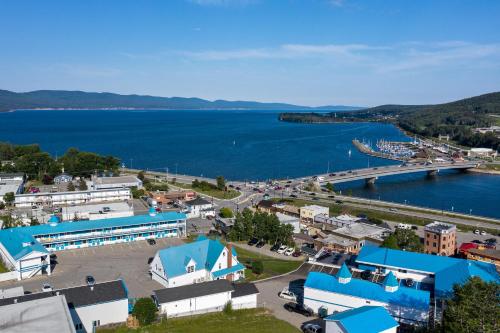 an aerial view of a town next to a body of water at Hotel Plante in Gaspé