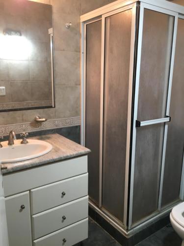 a bathroom with a shower and a sink and a toilet at 4 ambientes con cochera in Mar del Plata