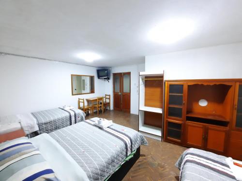 Ένα ή περισσότερα κρεβάτια σε δωμάτιο στο Hostal Dulzura