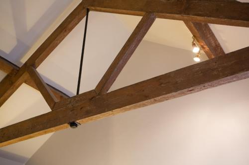 a glass ceiling in a room with wooden beams at The Peel Aldergate in Tamworth