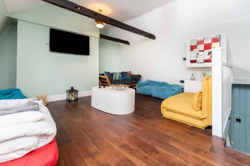 a living room with a couch and a table at Sealanes 1 in Brighton & Hove