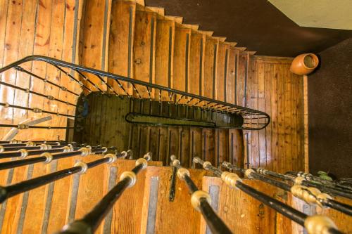 a set of stairs in a wooden wall at Hostal La Casa de La Plaza in Madrid