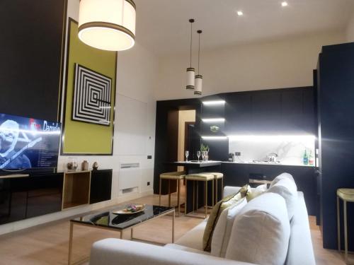 a living room with a couch and a table at Napoli Mariana Luxury in Naples