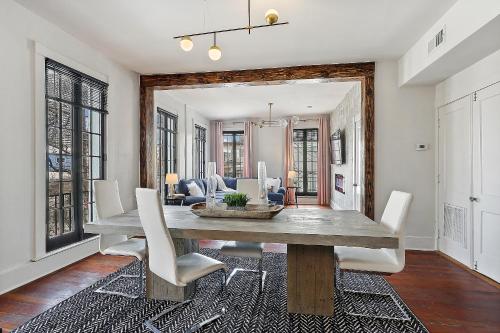 a dining room with a table and chairs at St Charles-Mardi Gras 6BD Home in New Orleans