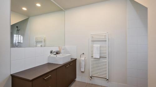 a bathroom with a sink and a mirror at Mitchell in Dinner Plain