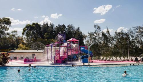 a water park with a slide in the water at Rydges Resort Hunter Valley in Lovedale