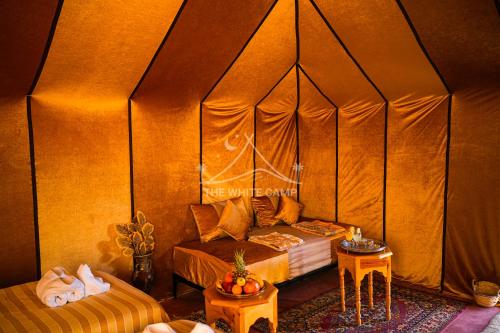 Una cama o camas en una habitación de The White Camp - Your Merzouga Luxury Desert Camp & Erg Chebbi Dunes Camel Riding
