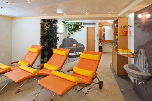 a group of chairs in a living room at Landhaus Aggenstein in Haldensee