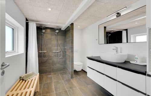 a bathroom with a sink and a shower at Amazing Home In Tranekr With Wifi in Tranekær