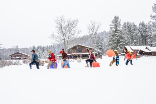 a group of people walking in the snow at Urban Cowboy Lodge in Big Indian