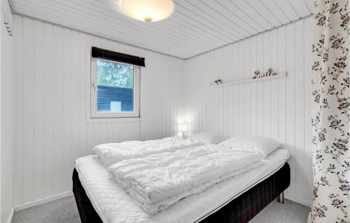 a white bedroom with a large bed in it at Gorgeous Home In Ulfborg With Wifi in Ulfborg