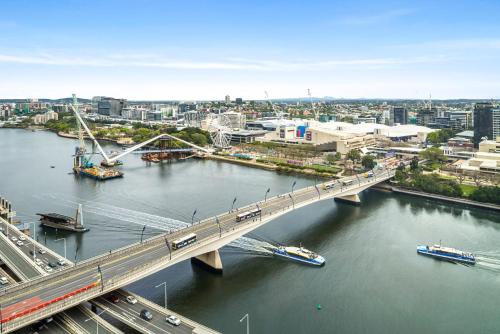 a bridge over a river with traffic on it at CASSA ONE - Luxury Apartments Managed by The Cassa in Brisbane