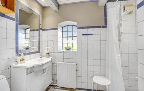 a bathroom with a sink and a shower at Awesome Home In Ask With 2 Bedrooms And Wifi in Maribo