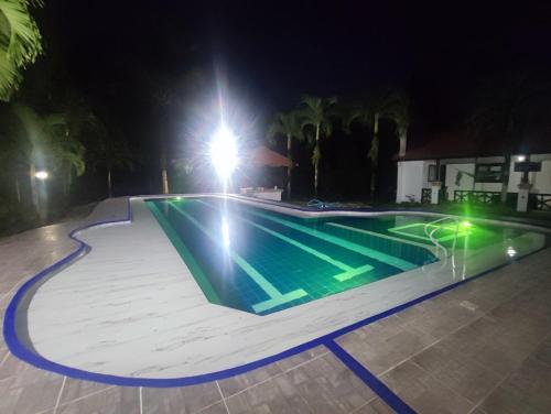 a swimming pool at night with a skateboard ramp at Casa Montenegro in Villavicencio