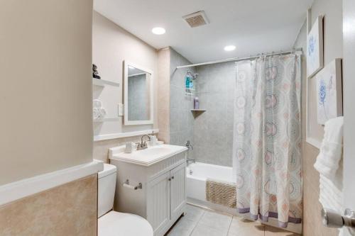 a bathroom with a sink and a toilet and a shower at Adorable 2-Bedroom Home in Hopewell near Hospital in Hopewell