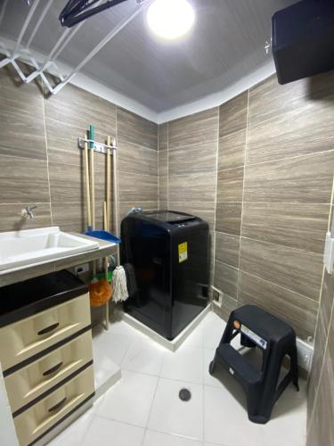 a bathroom with a toilet and a sink at Hostal La Princesa in Cartagena de Indias