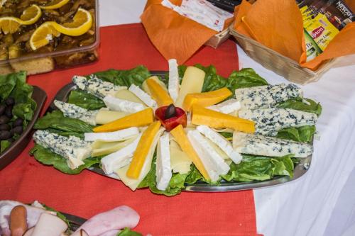 a plate of cheese and vegetables on a table at Sappho Hotel in Skala Eresou