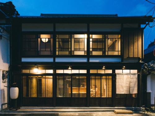 a black building with windows at night at RITA Yame Fukushima in Yame