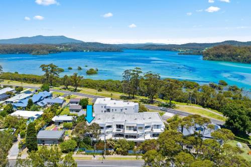 an aerial view of a house and the water at Unit 8 Boardwalk Apartments in Narooma