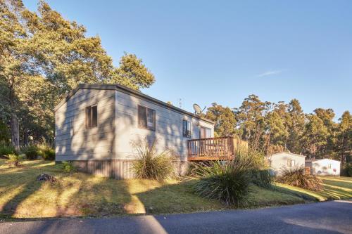 a tiny house on the side of a road at NRMA Port Arthur Holiday Park in Port Arthur
