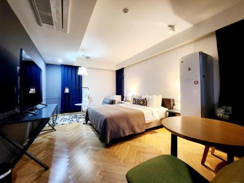 Ένα ή περισσότερα κρεβάτια σε δωμάτιο στο JS Boutique Hotel