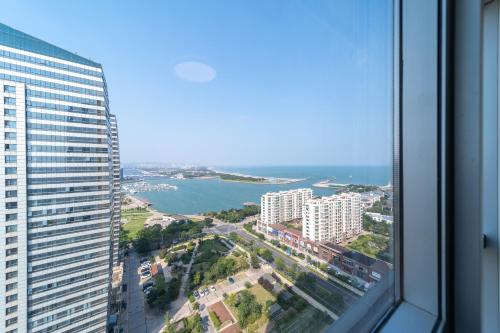a view of the ocean from a building at Cloud & Sea Boutique Apartment in Rizhao