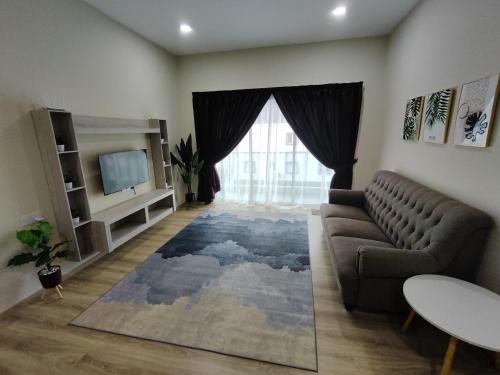 a living room with a couch and a large window at Muslim Apartment at The Quintet Cameron Highlands in Cameron Highlands