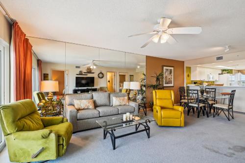 a living room with a couch and a table at SeaCrest 706 condo in Fort Walton Beach